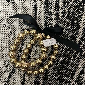 2 sets of Gold pearl bracelets with rhinestone details